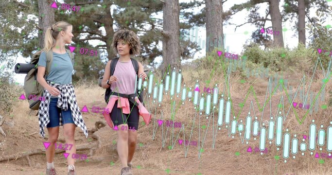 Hiking two women carrying pack, pad and daypack, wearing boots on pine trail, financial overlay - Powered by Adobe