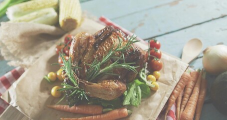 Displaying roasted chicken sitting on parchment on cutting board in rustic kitchen, with rosemary