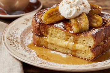 French toast with honey whipped cream and baked bananas