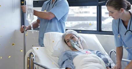 Monitoring patient wearing gown and oxygen mask on bed in hospital room, nurse adjusting IV pole