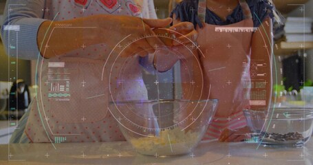 Mother and daughter cracking egg over glass mixing bowl at kitchen counter, with chips, aprons, HUD