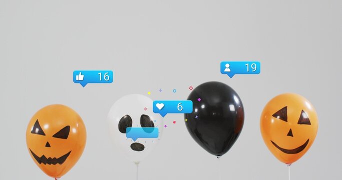Floating pumpkin, ghost and black balloons drifting across gray backdrop with notification icons