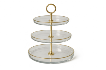 Elegant three-tiered glass and gold serving stand isolated on transparent background