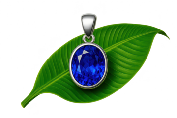 Blue gemstone pendant on a green leaf, cut-out with transparent background.