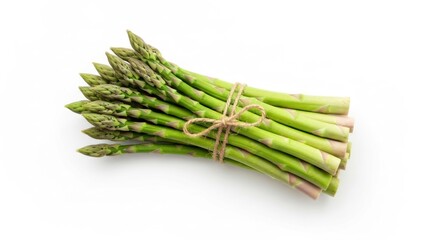 Bunch of fresh green asparagus tied with twine on a white backdrop, top-down view