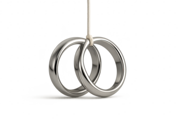 Intertwined wedding rings hanging by string, isolated on transparent background