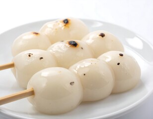 Sweet rice balls on skewers