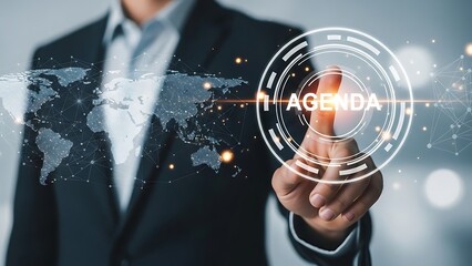 Businessman pressing agenda button on futuristic interface, symbolizing planning and strategy for global business success in the digital age.