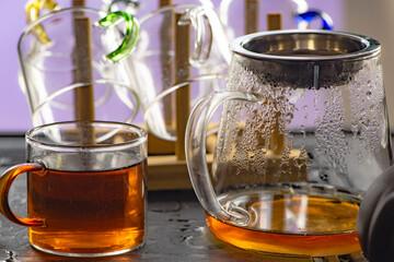 A close-up of a pile of glass tea sets