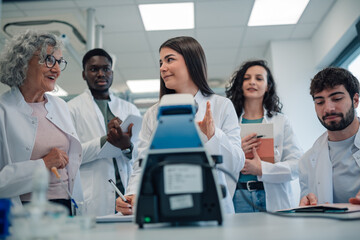 Fototapeta premium Diverse students and professor learning in science laboratory