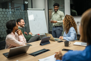 Diverse business team collaborating during office meeting presentation