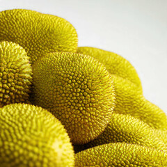 A stack of whole jackfruits with textured green skin and spiky patterns, arranged in a market setting. Ideal for tropical produce themes, organic food visuals, and exotic fruit displays.