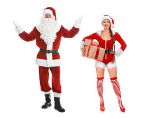 Man and woman in Santa costumes on white background. Merry Christmas and Happy winter holidays