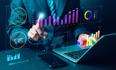 Business professional analyzing digital data dashboards with global charts, performance metrics and futuristic analytics visuals to support strategic decision-making in modern technology environments.