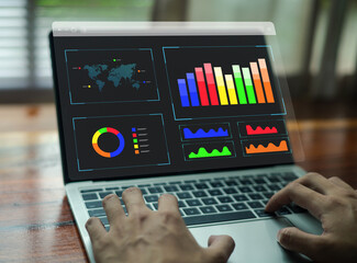 Colorful digital analytics dashboard with data charts, bar graphs, and visual metrics displayed on a laptop, representing business analysis, performance insights, KPI tracking.