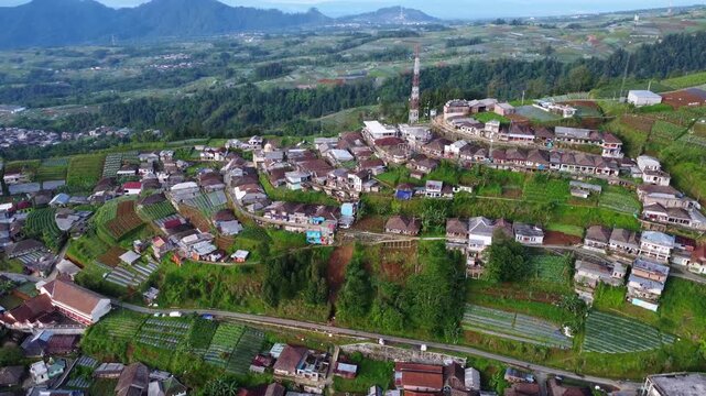 Cinematic aerial drone footage of Nepal Van Java village landscape in Central Java, Indonesia. Lush green hills and rural countryside captured in 4K with a serene and natural atmosphere.