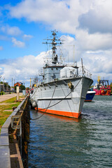 Fototapeta premium LVS Namejs M03 minehunter military vessel moored in the port of Liepaja on the west coast of Latvia in the Baltic Sea - This retired boat is now a training ship