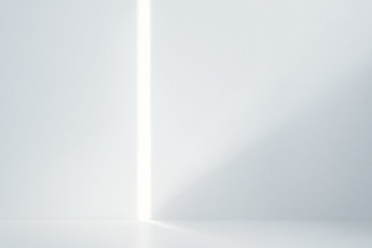 Bright vertical slit of light casting soft geometric shadows in a minimal white interior