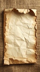 Aged paper on woven, rough texture