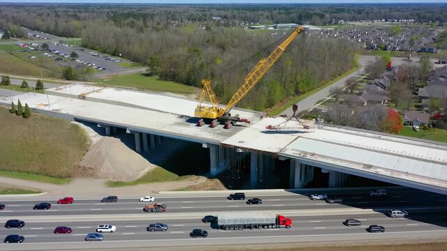 Highway Overpass Construction: Giant Crane Builds New Bridge (Aerial View)