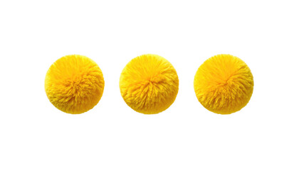 Three bright yellow, fuzzy pom-poms aligned horizontally against a stark black background; simple and visually striking