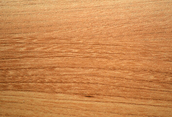 Naklejka premium Light cherry, a natural wood with a distinctive wavy grain, close-up.