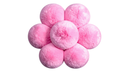 Seven fluffy, round, pink pom-poms arranged in a floral pattern against a solid black background