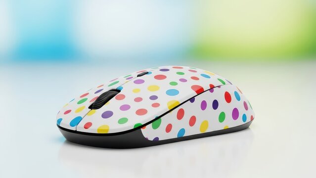White computer mouse with colorful polka dots on a white surface.