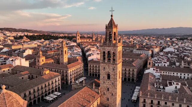 Aerial view of cordoba city skyline with the bell tower of the mezquitacathedral at sunset in andalusia, spain 4k video