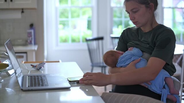 mother multitasking diligently, focused mother handling child and tasks, mother balances work and infant caregiving effectively, calm mother manages work and infant care simultaneously