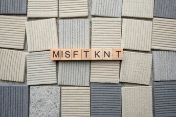 Flatlay of knitted textile squares with the word MISFIT KNIT