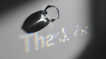 Octagonal crystal prism refracting light to project a "Thank You" message on a grey background for a gratitude concept and elegant visual - Powered by Adobe