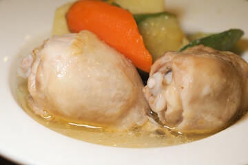 Savory chicken dish with vegetables in a broth
