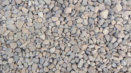 Seamless Abstract Texture of Small Gray and Beige River Pebbles