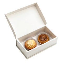 Assorted baked goods in a white box with elegant presentation and inviting textures