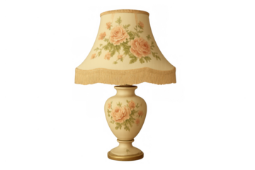 Vintage table lamp with floral rose pattern and fringed lampshade providing elegant home decoration