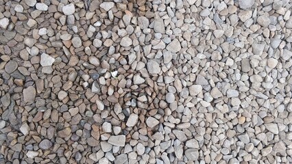 Seamless Abstract Texture of Small Gray and Beige River Pebbles