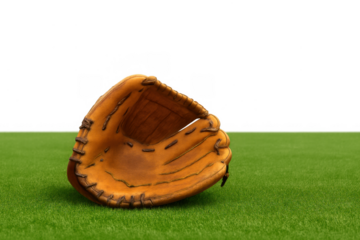 Baseball mitt resting on green grass with a transparent background; a classic leather glove ready for action in a sport game