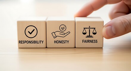 Wooden blocks representing business ethics responsibility honesty fairness