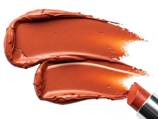 Two rich terracotta orange lipstick swatches smeared on a transparent background with the tip of the lipstick bullet visible in the corner