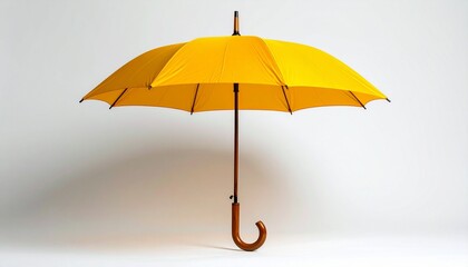 A bright yellow umbrella with a curved wooden handle standing open against a plain white background.
