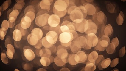 Warm golden light bokeh effect creates a blurred, abstract background featuring circular, out-of-focus highlights against a dark backdrop, producing a soft, inviting ambiance suitable for various...