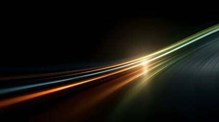 Abstract light trails with golden and silver streaks curve across a dark background generating motion blur