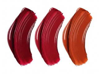 Three vibrant, glossy lipstick or makeup swatches showing deep red, bright red, and burnt orange shades isolated on transparent background