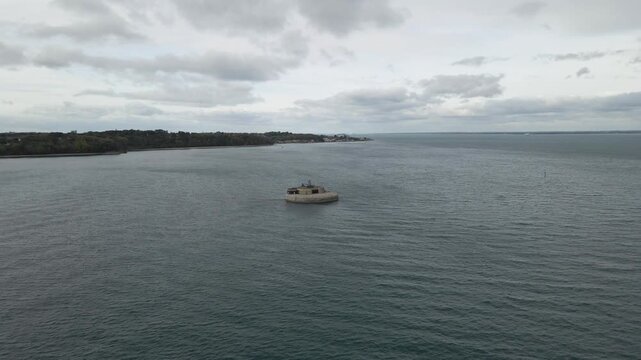 Aerial view St Helens Fort, sea fort in the Solent close to the Isle of Wight, was built as result of the Royal Commission on the Defence of the United Kingdom of 1859, drone moving towards the fort.
