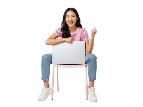 Excited young asian woman sitting on chair with laptop computer and showing success gesture isolated on transparent background