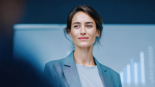 Confident leader in modern office leads work and business team meeting with focus on strategy and growth as colleagues listen and share ideas with calm energy and clear vision - Powered by Adobe