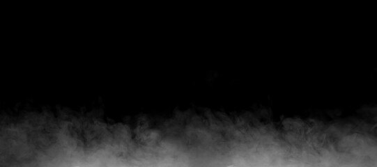 Low white fog spreading across the bottom of a dark black background, offering realistic atmospheric texture ideal for visual effects, dramatic scenes, creative design, and mystical compositions.