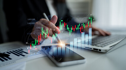 A business professional examines financial charts, using technology to analyze stock market trends, highlighting modern analysis in a bright office environment. Scalp
