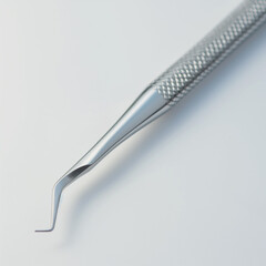 Closeup of dental scaler tool on white background